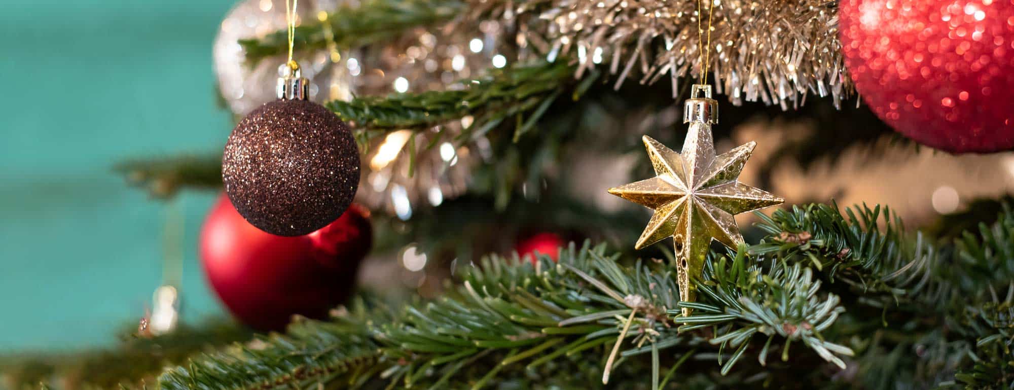 Closeup of Christmas star ornament on Christmas tree