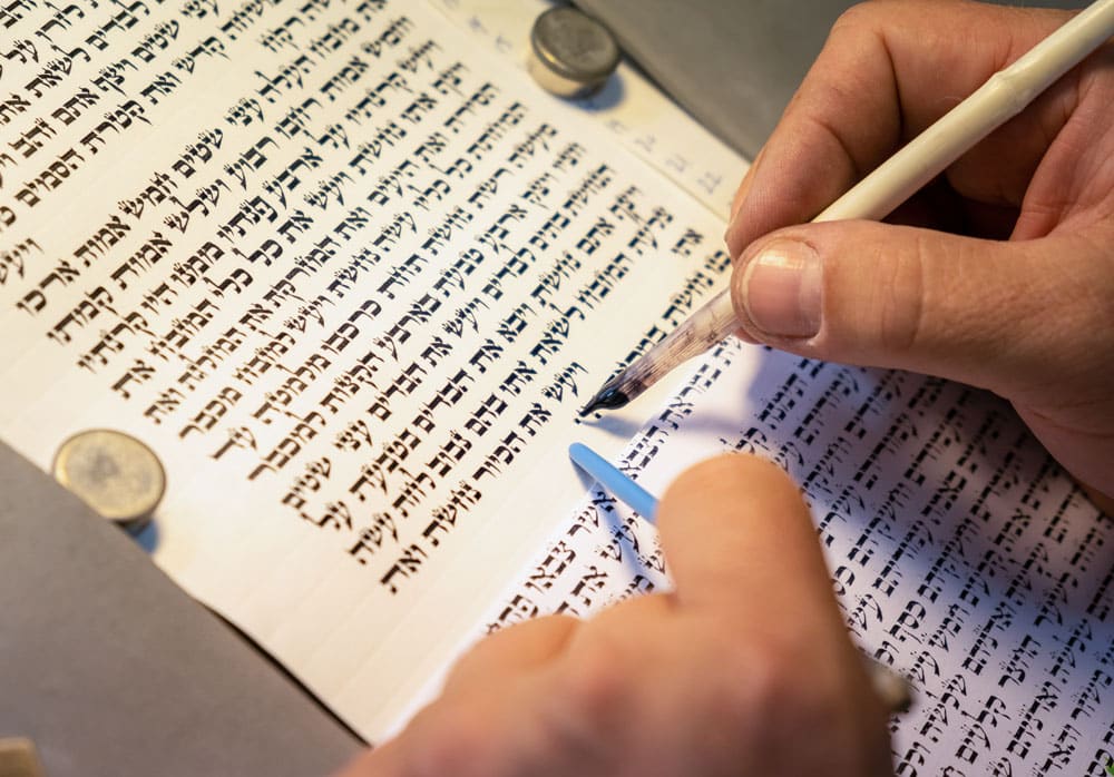Closeup of writing Hebrew by hand